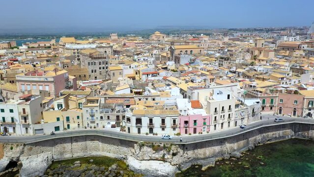 Cinematic drone shot of Syracuse coastline, historic city on the Italian island of Sicily