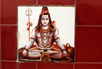 Shiva ceramic tile on a bathing ghat in Rishikesh