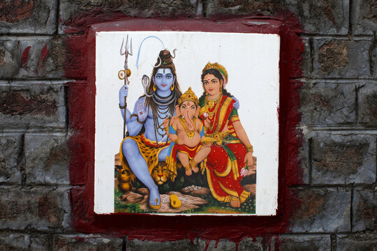 Shiva's family depicted on ceramic tile on a wall in Rishikesh