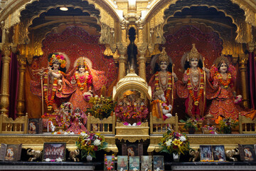 Bhaktivedanta Manor temple gods.left to right: Krishna, Rada, Rama, Sita, Laxmi.Hanuman in front of Rama