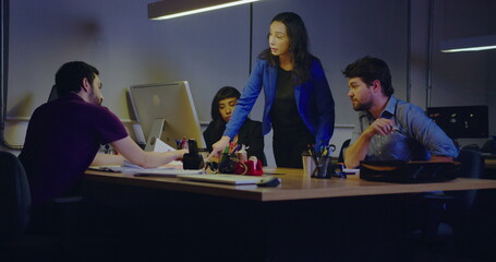 Executive female business woman speaking in front of staff. Employees at meeting listening to female boss