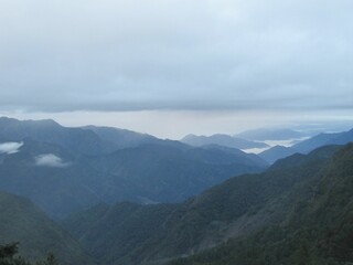 Beautiful view of Yushan also known as Mount Jade and hills on a foggy day in Taiwan