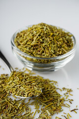 fragrant dried rosemary on a white acrylic background