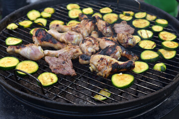 The vegetables are grilled. Meat on the grill