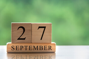 September 27 calendar date text on wooden blocks with copy space for ideas. Copy space and calendar concept