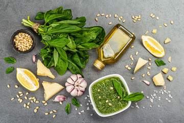 Pesto sauce in a bowls with pine nuts, parmesan and garlic. Traditional Italian food