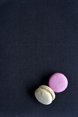 Macaroons on a colored background. Sweet macaroons. Delicious sweet cookies.