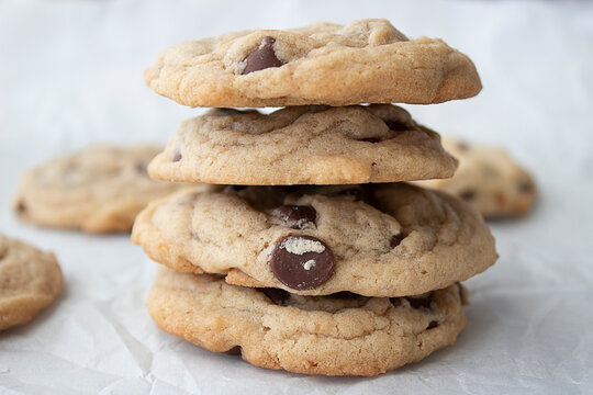 A stack of four chocolate chip cookies 