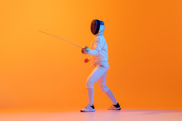 Studio shot of professional fencer in white fencing costume and mask in action, motion isolated on orange color background. Sport, youth, activity, skills, - obrazy, fototapety, plakaty