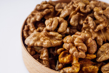 dried walnuts on a white acrylic background