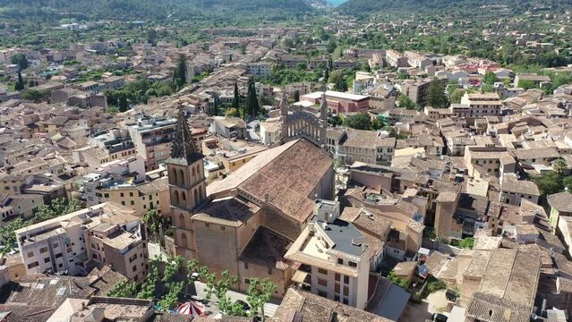 Helicopter view of the old town of S&oacute;ller, with the Church of St. Bartholomew, Roman Catholic parish church, S&oacute;ller, mountains behind, Serra de Tramuntana, Mallorca, Balearic Islands, Spain