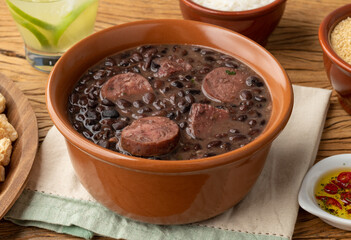 Typical brazilian feijoada with rice, caipirinha, farofa and cracklings