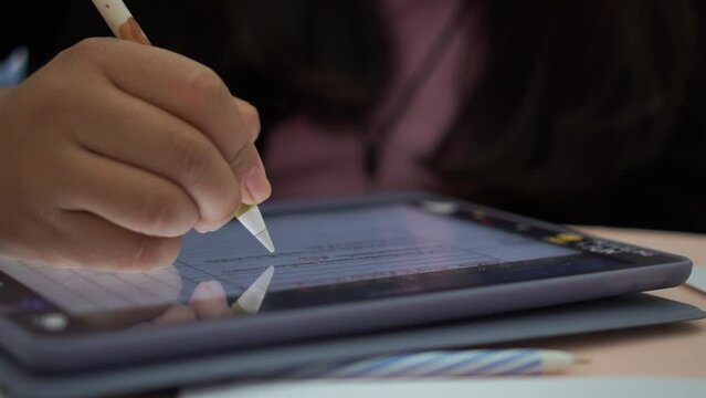 Businesswoman writing stylus pen note on digital tablet computer for E-learning education online learning, Using smartphone training coding application Developing program in meeting room. Slow shot - Powered by Adobe