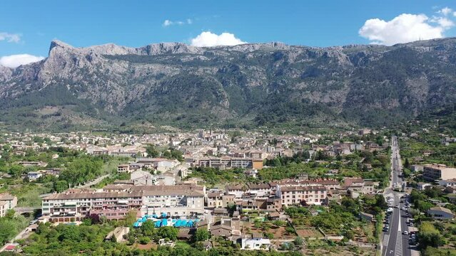 Helicopter view of the old town of S&oacute;ller, with the Church of St. Bartholomew, Roman Catholic parish church, S&oacute;ller, mountains behind, Serra de Tramuntana, Mallorca, Balearic Islands, Spain