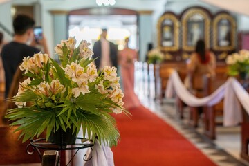 The interior of the church decorated with Alstroemeria flowers for the wedding ceremony