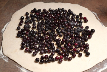 Process of preparing pie with wild cherry - a moldavian traditional summer dish