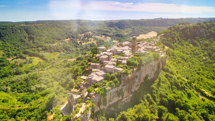 Panoramic aerial view of Civita di Bagnoregio from a flying drone around the medieval city, Italy. - obrazy, fototapety, plakaty