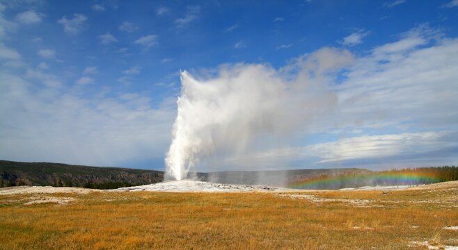 Scenic view of the Old Faithful cone geyser in Yellowstone National Park in Wyoming, United States