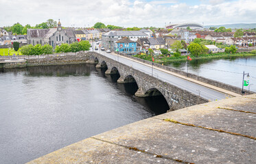 Thomond Bridge across the River Shannon from King John's Castle, Limerick, Ireland