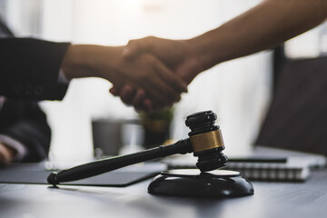 Handshake. Business people shake hands with lawyers contract legal cooperation agreement.