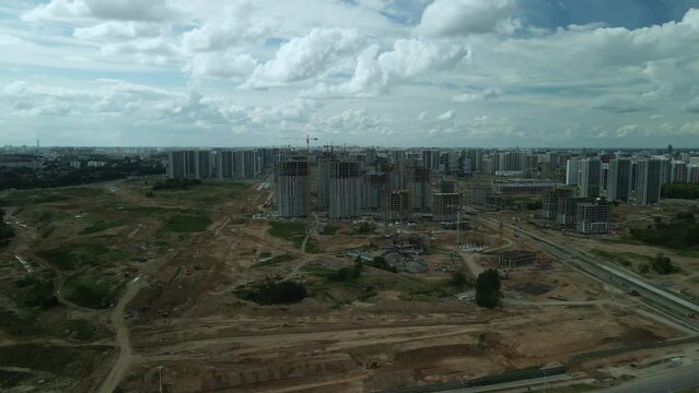 Construction site. Construction of multi-storey buildings. Construction of a city block. Aerial photography.
