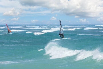 Obraz premium Windsurfing on the waves of the Mediterranean Sea