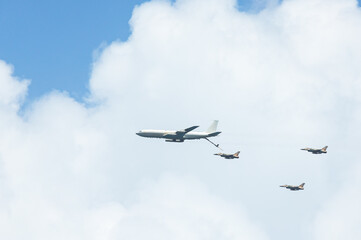 Military aircraft against the blue sky