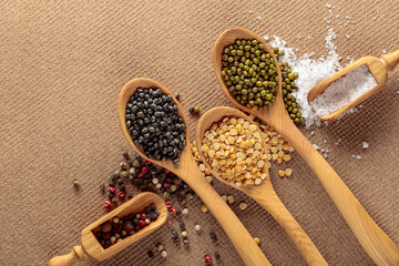 Various raw lentils with salt and pepper.
