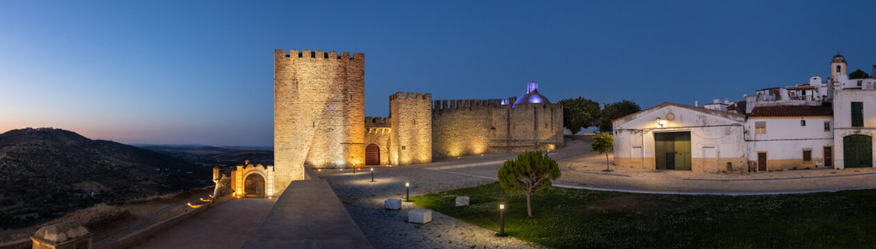 Elvas, Portugal: Castelo of Elvas with the fort "Forte da Graca" on the hill to the left. Panoramic image from several single images. Blue hour / twilight shot.