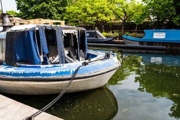 Colorful typical narrowboats moored along Little Venice basin, near the Paddington Basin. 