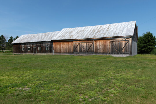 A beautiful old barn on a blue sky