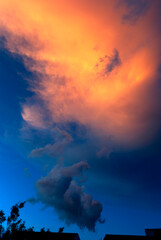 Naklejka premium Clouds in the open sky dramatic sunset in latin america, natural space to meditate and live the universe in a relaxed evening.