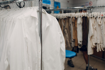 Dry cleaning white shirts clothes. Clean cloth chemical process. Laundry industrial dry-cleaning.