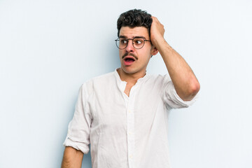 Fototapeta premium Young caucasian man isolated on blue background being shocked, she has remembered important meeting.