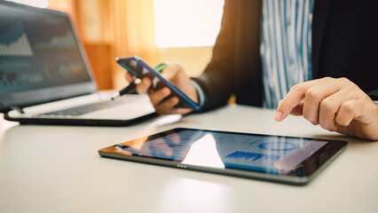 Fototapeta premium Businessman investment accounting analysis company financial report balance statement working with graphs chart result. Concept for entrepreneur business and economy of company.