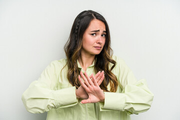Young caucasian woman isolated on white background doing a denial gesture