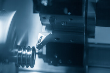 The  CNC lathe machine groove  cutting at the metal pulley part.