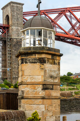 The world's smallest working light tower sits in North Queensferry, alongside one of the engineering wonders of the world.