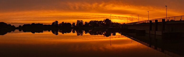 Beautiful sunset with reflections near Plattling, Isar, Bavaria, Germany