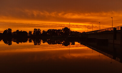 Beautiful sunset with reflections near Plattling, Isar, Bavaria, Germany