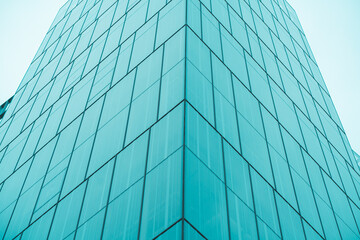 underside panoramic and perspective view to steel blue glass high rise building skyscrapers
