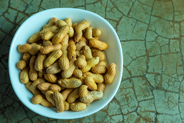 peanut kept in a bowl,ready to eat.