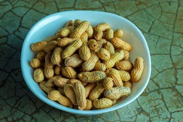 peanut kept in a bowl,ready to eat.