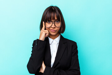 Young business mixed race woman isolated on blue background pointing temple with finger, thinking, focused on a task.