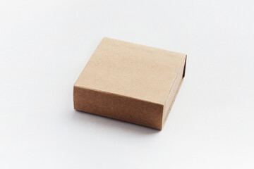 Cardboard craft box. Mailbox isolated on a white background. Open rectangular small brown box for transporting goods isolated on a white background, front view. Recycled paper.