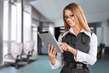 Confident stylish european business woman standing at workplace.