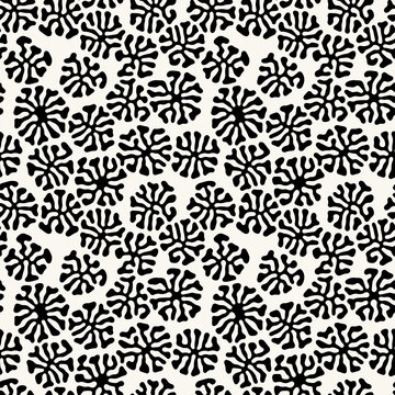 Vector seamless pattern. Free form organic shapes. Stylish structure of natural spots. Hand-drawn abstract background. Can be used as a tileable swatch. Monochrome spotty print.