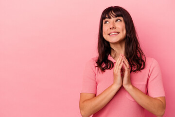 Young caucasian woman isolated on pink background making up plan in mind, setting up an idea.