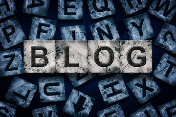 Blog, word on an alphabet on stone blocks, on dark blue background.