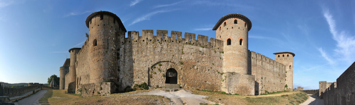 Panoramic view of the old city walls of Carcassonne with a gate and the towers of la Marquière and Samson, Aude department in France